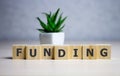 Funding Word Written In Wooden Cube, business concept