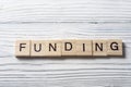 FUNDING word written on wooden cubes. Finance Concept. Money