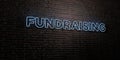 FUNDRAISING -Realistic Neon Sign on Brick Wall background - 3D rendered royalty free stock image