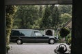 funeral black van parked in front of the crematory