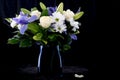 Funeral Bouquet purple White flowers, Sympathy and Condolence Concept on blackbackground with copy space Royalty Free Stock Photo