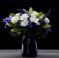 Funeral Bouquet purple White flowers, Sympathy and Condolence Concept on blackbackground with copy space Royalty Free Stock Photo