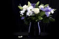 Funeral Bouquet purple White flowers, Sympathy and Condolence Concept on blackbackground with copy space Royalty Free Stock Photo