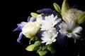 Funeral Bouquet purple White flowers, Sympathy and Condolence Concept on blackbackground with copy space Royalty Free Stock Photo