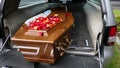 Funeral casket or coffin in a hearse or chapel or burial at cemetery Royalty Free Stock Photo