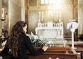 Funeral coffin, death and woman in church after the loss of family, friend or loved one from cancer. RIp, mourning and