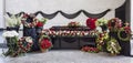 Funeral, coffin, decorated with wreaths, in the farewell hall, panorama. Royalty Free Stock Photo