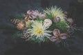 Funeral concept and floral decoration on grave in cemetery in All Saints Day