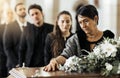 Funeral, death and coffin in church or Christian family gathering together for support. Religion, sad people and Royalty Free Stock Photo