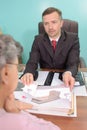 Funeral director with mourning widow