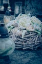 Funeral floral decoration concept on grave in cemetery in All Saints Day