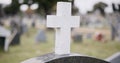 Funeral, graveyard and cross on tombstone for death ceremony, religion or memorial service. Catholic symbol, background Royalty Free Stock Photo