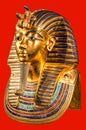 Funeral mask of pharaoh Tutankhamun on red background Royalty Free Stock Photo