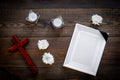 Funeral. Mockup of portrait of the deceased, of dead person. Frame with black ribbon near flowers, candles and cross on