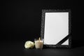 Funeral photo frame with ribbon, white rose and candle on background. Space for design Royalty Free Stock Photo