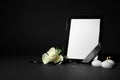 Funeral photo frame with ribbon, white roses and candles on background. Space for design Royalty Free Stock Photo