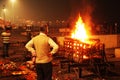 Funeral pyre that night,  Manikarnika Ghat, Ganges river in Royalty Free Stock Photo