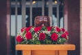 Funerary urn with ashes of dead and flowers at funeral