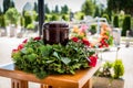 Funerary urn with ashes of dead and flowers at funeral Royalty Free Stock Photo