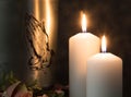 A funeray metal urn with praying hands and burning candlesMourning moment at the end of a life. Last farewell. Copy space. Condole Royalty Free Stock Photo