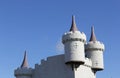 Funfair turrets against a blue sky