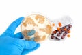 Fungi on agar plate and pills Royalty Free Stock Photo