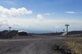 Funicular and gravel road leading to the summit on mount Etna Royalty Free Stock Photo