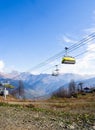 Funicular in the mountains with yellow seats