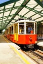 Funicular tramway whith Vintage passenger tram cars. Italian mountain electric train departs from SASSI station to the Basilica Di