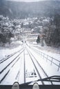 Funicular window view with snowy forest and town Royalty Free Stock Photo