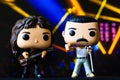 Funko POPO vinyl figures of Freddie Mercury and John Deacon(Queen) on concert stage background Royalty Free Stock Photo