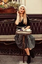 Funky beauty. parisian woman wear french beret. pretty girl relax in cafe. morning coffee for breakfast. sexy blond with Royalty Free Stock Photo