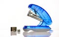 Blue stapler on a white background with staples Royalty Free Stock Photo