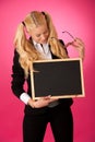 Funky business woman holding a blank blackboard - teacher Royalty Free Stock Photo