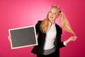 Funky business woman holding a blank blackboard - teacher Royalty Free Stock Photo