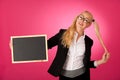 Funky business woman holding a blank blackboard - teacher Royalty Free Stock Photo