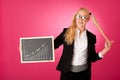 Funky business woman holding a blank blackboard - teacher Royalty Free Stock Photo