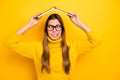 Funky funny foolish nerd girl have high school rest relax put book above head grimace wear stylish sweater isolated over Royalty Free Stock Photo