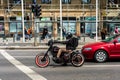 Funky hipster riding a vintage custom motorcycle in Bucharest, Romania, 2020