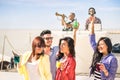 Funky people dancing music and having fun together at beach rave