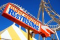 A retro sign points the way to the restrooms Royalty Free Stock Photo