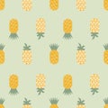 Funky yellow pineapples on a pastel green background