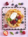 Funnel cakes with fresh berries and whipped cream Royalty Free Stock Photo