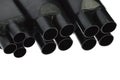 Funnel looking black rubber shrinkable cable breakout boots of various diameters, white background Royalty Free Stock Photo