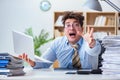 The funny accountant bookkeeper working in the office Royalty Free Stock Photo