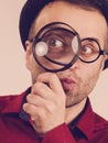 Funny man with magnifying glass Royalty Free Stock Photo