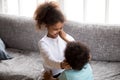 Funny African American children playing together indoors Royalty Free Stock Photo
