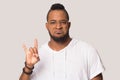 Funny African American man showing cool rock gesture symbol