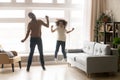 Funny african father and kid daughter laughing jumping at home Royalty Free Stock Photo