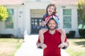 Funny amazed school boy going to school with father.